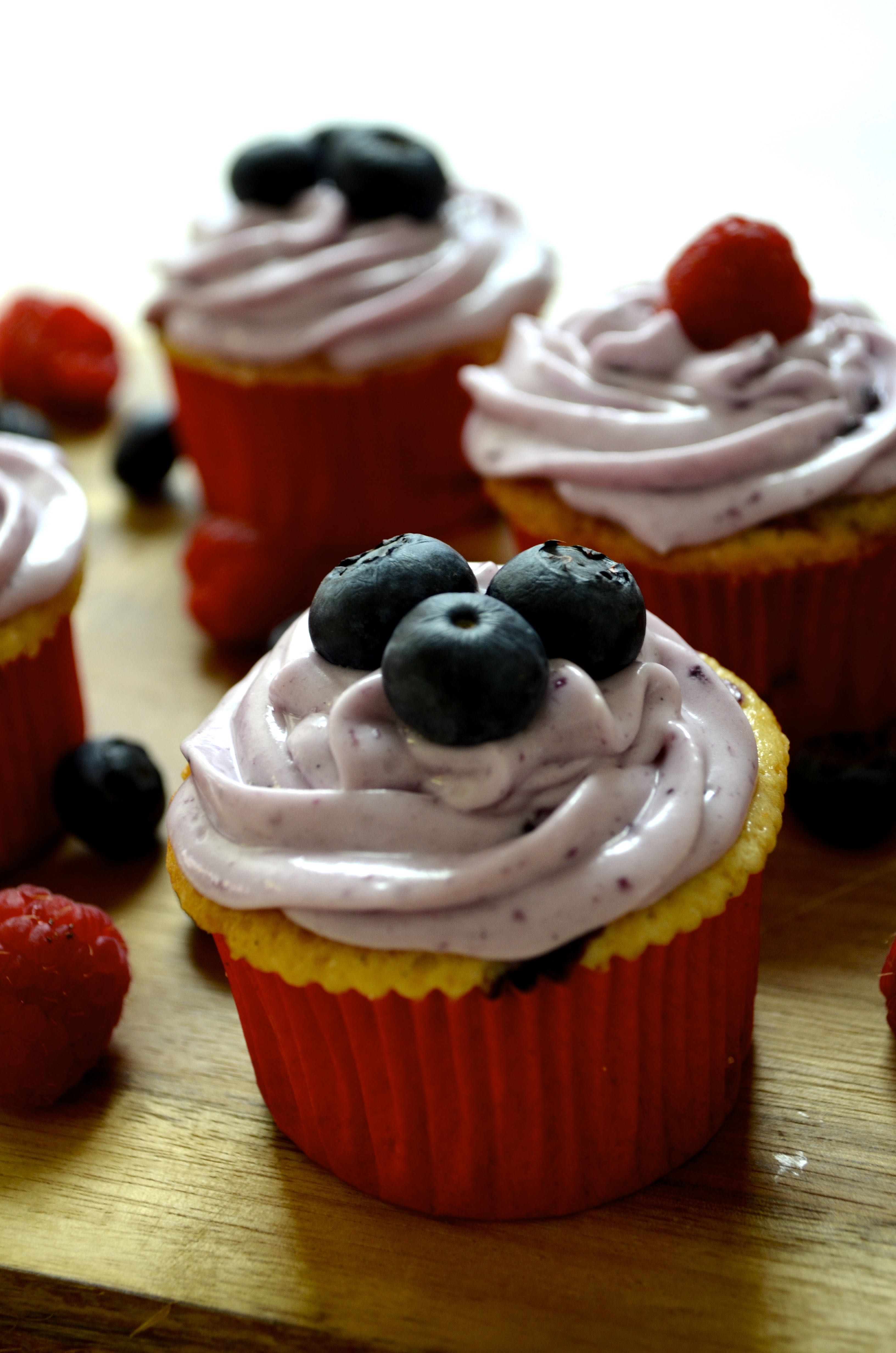 Berry Cream Cheese Cupcakes at www.laughlovekiss.com.  The perfect summer cupcake!