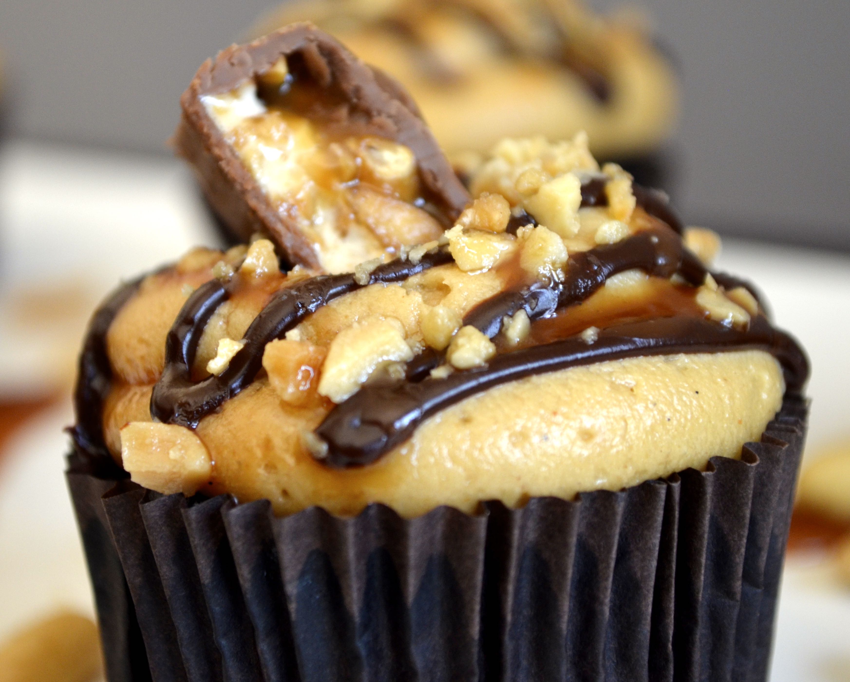 Snickers Cupcakes at www.laughlovekiss.com